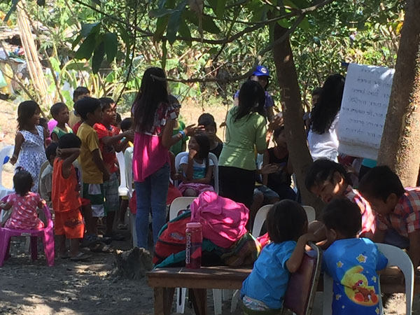 teaching children in San Fabian by the South China Sea